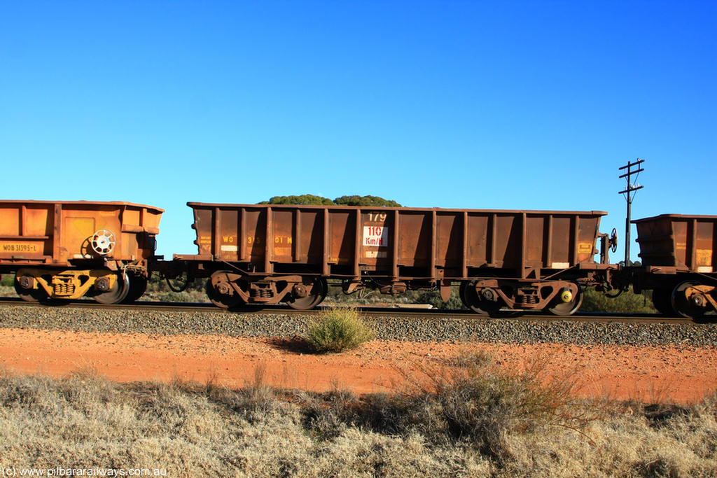 100731 02425
WO type iron ore waggon WO 31301 is one of a batch of fifteen built by WAGR Midland Workshops between July and October 1968 with fleet number 179 for Koolyanobbing iron ore operations, with a 75 ton and 1018 ft³ capacity, on empty train 6418 at Binduli Triangle, 31st July 2010. This unit was converted to WOC for coal in 1986 till 1994 when it was re-classed back to WO.
Keywords: WO-type;WO31301;WAGR-Midland-WS;