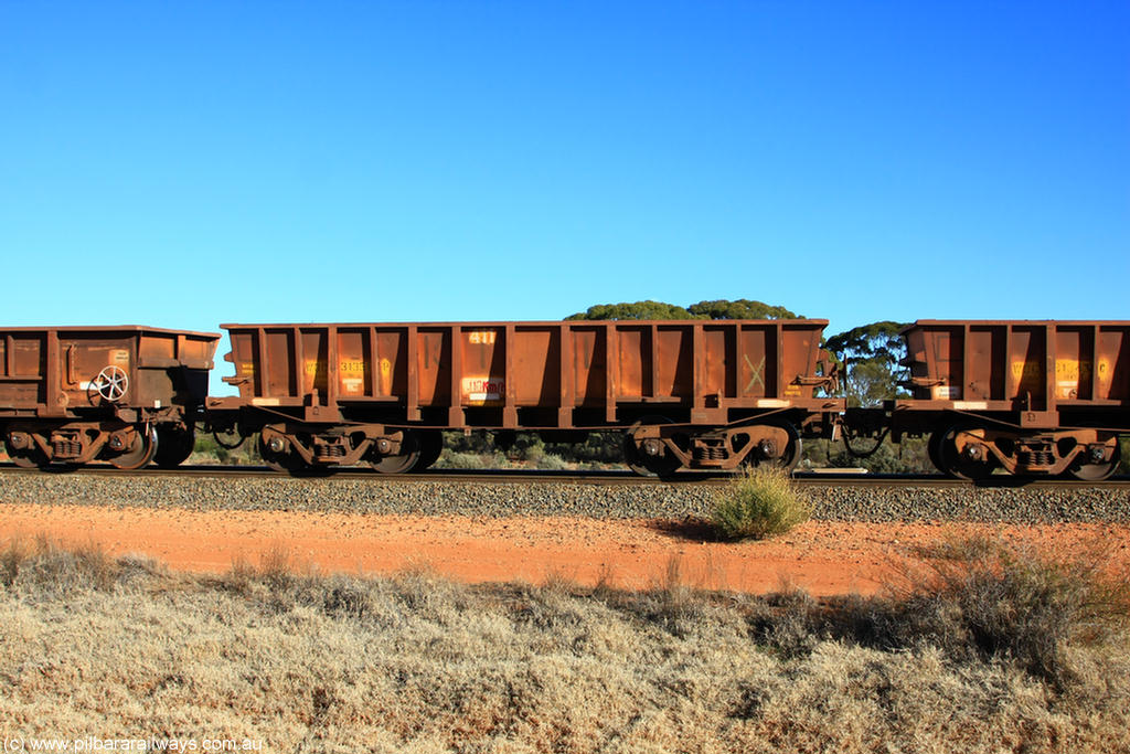 100731 02434
WOC type iron ore waggon WOC 31351 is one of a batch of thirty built by Goninan WA between October 1997 to January 1998 with fleet number 411 for Koolyanobbing iron ore operations with a 75 ton capacity, on empty train 6418 at Binduli Triangle, 31st July 2010.
Keywords: WOC-type;WOC31351;Goninan-WA;