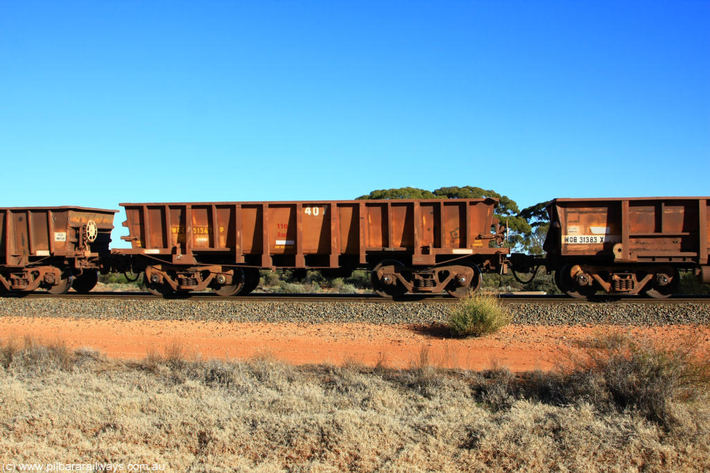 100731 02436
WOC type iron ore waggon WOC 31347 is one of a batch of thirty built by Goninan WA between October 1997 to January 1998 with fleet number 407 for Koolyanobbing iron ore operations with a 75 ton capacity, on empty train 6418 at Binduli Triangle, 31st July 2010.
Keywords: WOC-type;WOC31347;Goninan-WA;