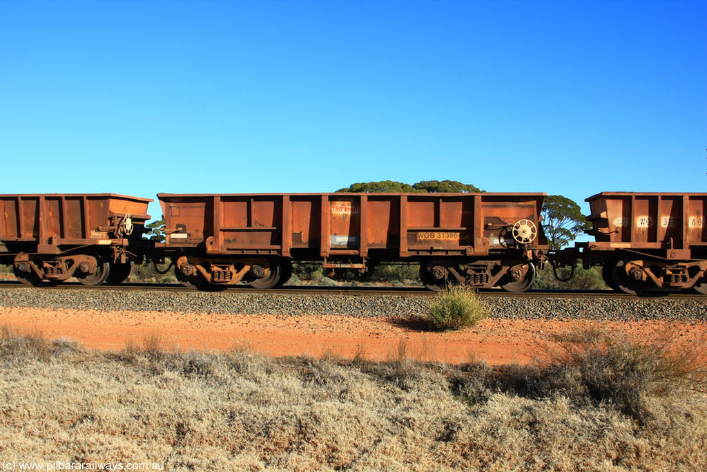 100731 02439
WOB type iron ore waggon WOB 31386 is one of a batch of twenty five built by Comeng WA between 1974 and 1975 and converted from Mt Newman high sided waggons by WAGR Midland Workshops with a capacity of 67 tons with fleet number 311 for Koolyanobbing iron ore operations. This waggon was also converted to a WSM type ballast hopper by re-fitting the cut down top section and having bottom discharge doors fitted, converted back to WOB in 1998, on empty train 6418 at Binduli Triangle, 31st July 2010.
Keywords: WOB-type;WOB31386;Comeng-WA;WSM-type;Mt-Newman-Mining;
