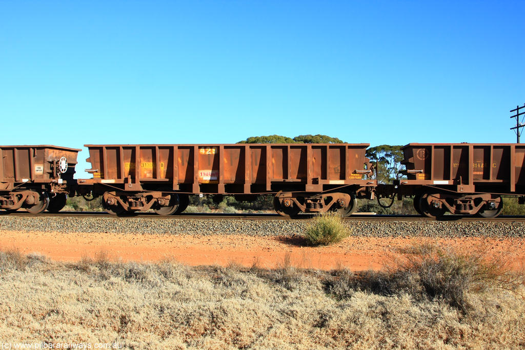 100731 02449
WOC type iron ore waggon WOC 31369 is one of a batch of thirty built by Goninan WA between October 1997 to January 1998 with fleet number 429 for Koolyanobbing iron ore operations with a 75 ton capacity, on empty train 6418 at Binduli Triangle, 31st July 2010.
Keywords: WOC-type;WOC31369;Goninan-WA;