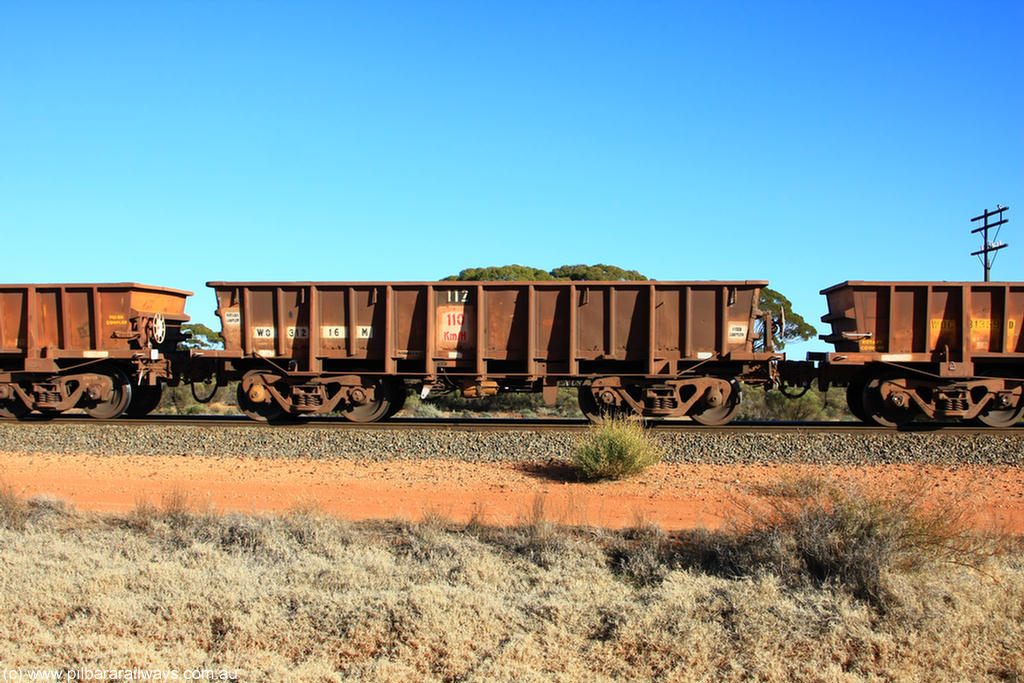 100731 02450
WO type iron ore waggon WO 31216 is one of a batch of eighty six built by WAGR Midland Workshops between 1967 and March 1968 with fleet number 112 for Koolyanobbing iron ore operations, with a 75 ton and 1018 ft³ capacity, on empty train 6418 at Binduli Triangle, 31st July 2010. This unit was converted to WOS superphosphate in the late 1980s till 1994 when it was re-classed back to WO.
Keywords: WO-type;WO31216;WAGR-Midland-WS;WOS-type;