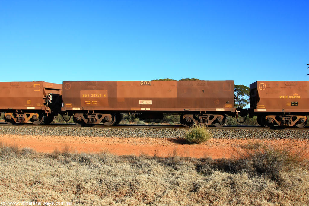 100731 02471
WOE type iron ore waggon WOE 30254 is one of a batch of one hundred and thirty built by Goninan WA between March and August 2001 with serial number 950092-004 and fleet number 604 for Koolyanobbing iron ore operations, on empty train 6418 at Binduli Triangle, 31st July 2010.
Keywords: WOE-type;WOE30254;Goninan-WA;950092-004;