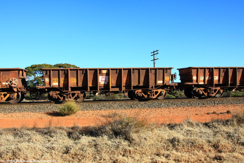 100731 02532
WO type iron ore waggon WO 31213 is one of a batch of eighty six built by WAGR Midland Workshops between 1967 and March 1968 with fleet number 109 for Koolyanobbing iron ore operations, with a 75 ton and 1018 ft³ capacity, on empty train 6418 at Binduli Triangle, 31st July 2010. This unit was converted to WOG for gypsum in late 1980s till 1990 then reclassed to WOS for superphosphate before being re-classed back to WO in 1994.
Keywords: WO-type;WO31213;WAGR-Midland-WS;