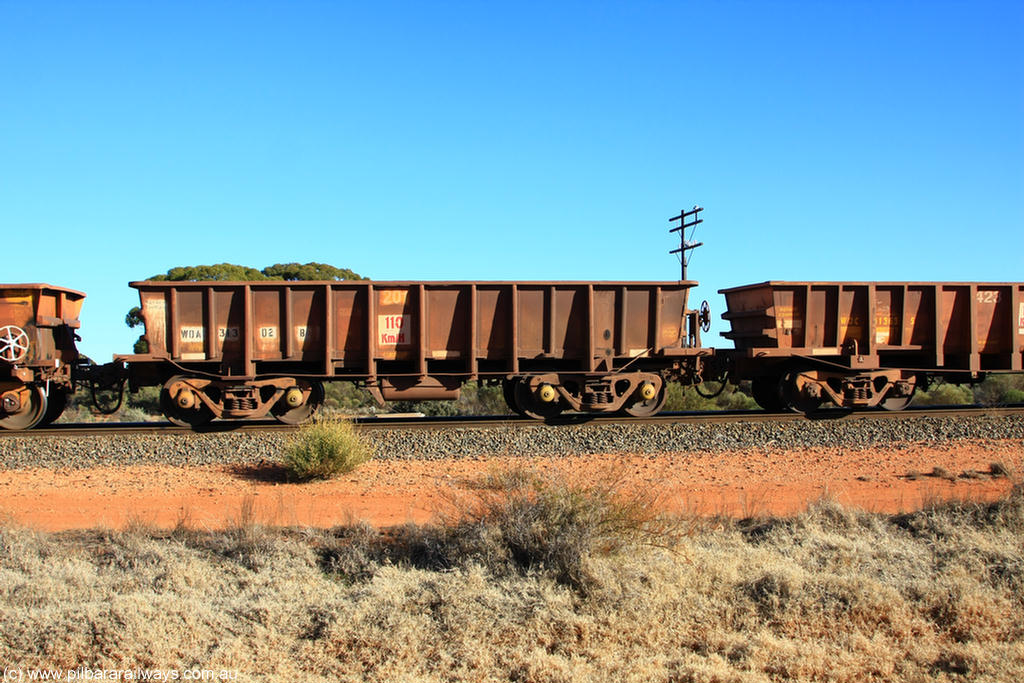 100731 02539
WOA type iron ore waggon WOA 31302 is leader of a batch of thirty nine built by WAGR Midland Workshops between 1970 and 1971 with fleet number 201 for Koolyanobbing iron ore operations, with a 75 ton and 1018 ft³ capacity, on empty train 6418 at Binduli Triangle, 31st July 2010.
Keywords: WOA-type;WOA31302;WAGR-Midland-WS;type-leader;