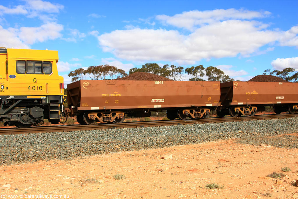 100731 02823
WOE type iron ore waggon WOE 33442 is one of a batch of seventeen built by United Group Rail WA between July and August 2008 with serial number 950209-006 and fleet number 8941 for Koolyanobbing iron ore operations, on loaded train 7415 at Binduli Triangle, 31st July 2010.
Keywords: WOE-type;WOE33442;United-Group-Rail-WA;950209-006;