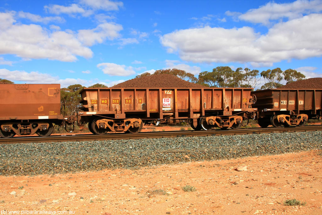 100731 02848
WO type iron ore waggon WO 31230 is one of a batch of sixty two built by Goninan WA between April and August 2000 with serial number 950086-004 and fleet number 122 for Koolyanobbing iron ore operations, and is a Goninan built replacement WO type waggon that replaces the original WAGR built WO type waggon with the newer style WOD type and has square features opposed to the curved ones as on the original WO class, on loaded train 7415 at Binduli Triangle, 31st July 2010.
Keywords: WO-type;WO31230;Goninan-WA;950086-004;