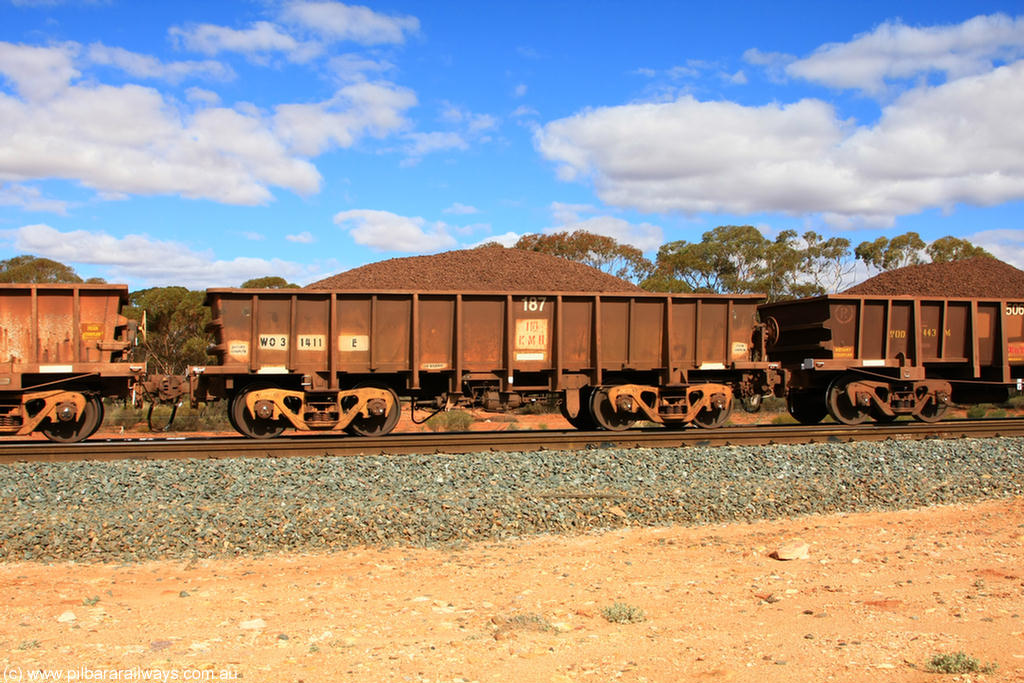 100731 02849
WO type iron ore waggon WO 31411 is one of a batch of eleven replacement waggons built by WAGR Midland Workshops between 1970 and 1971 with fleet number 187 for Koolyanobbing iron ore operations, with a 75 ton and 1018 ft³ capacity, on loaded train 7415 at Binduli Triangle, 31st July 2010. This unit was converted to WOC for coal in 1986 till 1994 when it was re-classed back to WO.
Keywords: WO-type;WO31411;WAGR-Midland-WS;