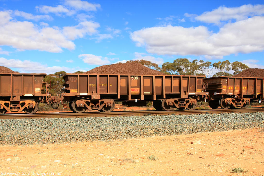 100731 02850
WOD type iron ore waggon WOD 31443 is one of a batch of sixty two built by Goninan WA between April and August 2000 with serial number 950086-016 and fleet number 506 for Koolyanobbing iron ore operations, build date 05/2000, with a 75 ton capacity, for Portman Mining to cart their Koolyanobbing iron ore to Esperance, now with PORTMAN painted out, on loaded train 7415 at Binduli Triangle, 31st July 2010.
Keywords: WOD-type;WOD31443;Goninan-WA;950086-016;
