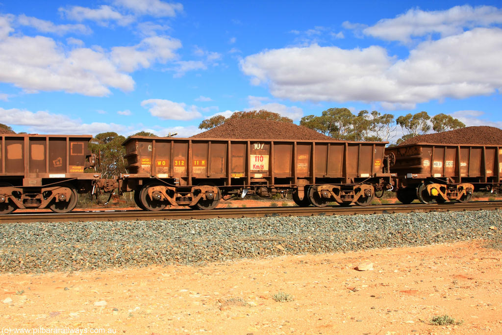 100731 02851
WO type iron ore waggon WO 31211 is one of a batch of eighty six built by WAGR Midland Workshops between 1967 and March 1968 with fleet number 107 for Koolyanobbing iron ore operations, with a 75 ton and 1018 ft³ capacity, on loaded train 7415 at Binduli Triangle, 31st July 2010. This unit was converted to WOC for coal in 1986 till 1994 when it was re-classed back to WO.
Keywords: WO-type;WO31211;WAGR-Midland-WS;