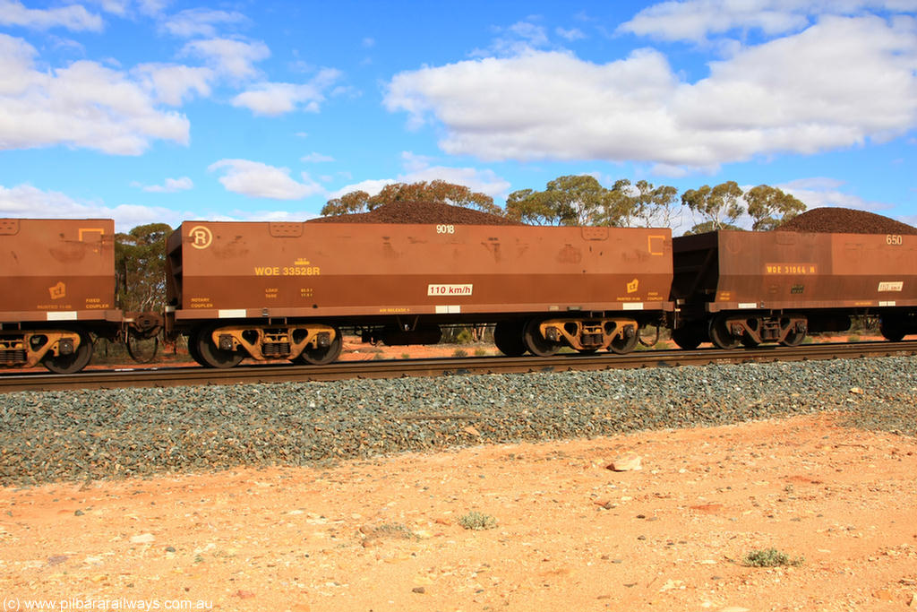 100731 02872
WOE type iron ore waggon WOE 33528 is one of a batch of one hundred and twenty eight built by United Group Rail WA between August 2008 and March 2009 with serial number 950211-068 and fleet number 9018 for Koolyanobbing iron ore operations, on loaded train 7415 at Binduli Triangle, 31st July 2010.
Keywords: WOE-type;WOE33528;United-Group-Rail-WA;950211-068;
