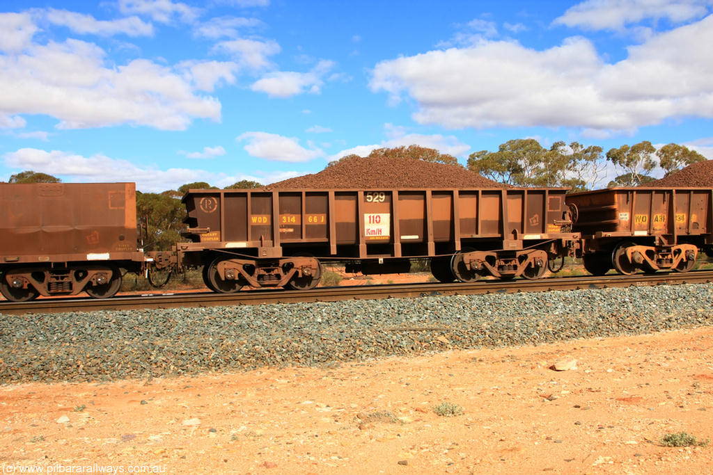 100731 02875
WOD type iron ore waggon WOD 31466 is one of a batch of sixty two built by Goninan WA between April and August 2000 with serial number 950086-038 and fleet number 529 for Koolyanobbing iron ore operations with a 75 ton capacity for Portman Mining to cart their Koolyanobbing iron ore to Esperance, now with PORTMAN painted out, on loaded train 7415 at Binduli Triangle, 31st July 2010.
Keywords: WOD-type;WOD31466;Goninan-WA;950086-038;