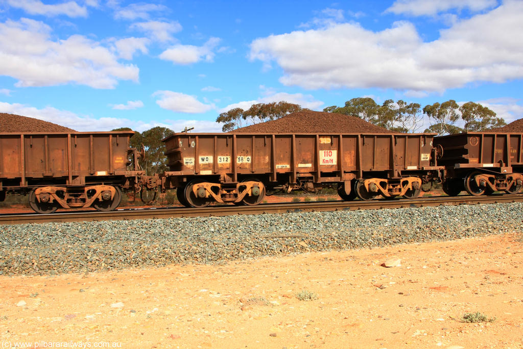 100731 02882
WO type iron ore waggon WO 31258 is one of a batch of eighty six built by WAGR Midland Workshops between 1967 and March 1968 with fleet number 145 for Koolyanobbing iron ore operations, with a 75 ton and 1018 ft³ capacity, on loaded train 7415 at Binduli Triangle, 31st July 2010. This unit was converted to WOS superphosphate in the late 1980s till 1994 when it was re-classed back to WO.
Keywords: WO-type;WO31258;WAGR-Midland-WS;WOS-type