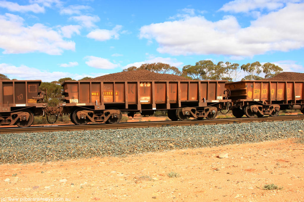 100731 02885
WOC type iron ore waggon WOC 31355 is one of a batch of thirty built by Goninan WA between October 1997 to January 1998 with fleet number 415 for Koolyanobbing iron ore operations with a 75 ton capacity, on loaded train 7415 at Binduli Triangle, 31st July 2010.
Keywords: WOC-type;WOC31355;Goninan-WA;