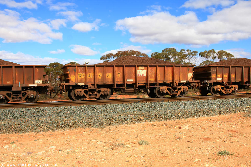 100731 02886
WO type iron ore waggon WO 31401 is leader of a batch of eleven replacement waggons built by WAGR Midland Workshops between 1970 and 1971 with fleet number 180 for Koolyanobbing iron ore operations, with a 75 ton and 1018 ft³ capacity, on loaded train 7415 at Binduli Triangle, 31st July 2010. This unit was converted to WOC for coal in 1986 till 1994 when it was re-classed back to WO.
Keywords: WO-type;WO31401;WAGR-Midland-WS;