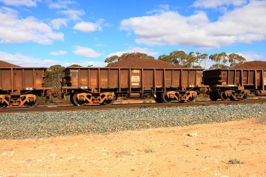 100731 02891
WO type iron ore waggon WO 31281 is one of a batch of eighty six built by WAGR Midland Workshops between 1967 and March 1968 with fleet number 161 for Koolyanobbing iron ore operations, with a 75 ton and 1018 ft³ capacity, on loaded train 7415 at Binduli Triangle, 31st July 2010. This unit was converted to WOC for coal in 1986 till 1994 when it was re-classed back to WO.
Keywords: WO-type;WO31281;WAGR-Midland-WS;