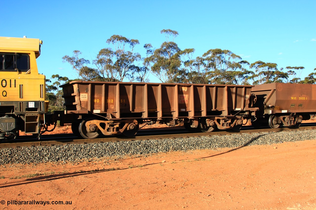 100731 03056
WO type iron ore waggon WO 31251 is one of a batch of eighty six built by WAGR Midland Workshops between 1967 and March 1968 with fleet number 140 for Koolyanobbing iron ore operations, with a 75 ton and 1018 ft³ capacity, empty train arriving at Binduli Triangle, 31st July 2010. This unit was converted to WOC for coal in 1986 till 1990 when it was reclassed to WOG for gypsum, then it was re-classed back to WO in 1994.
Keywords: WO-type;WO31251;WAGR-Midland-WS;