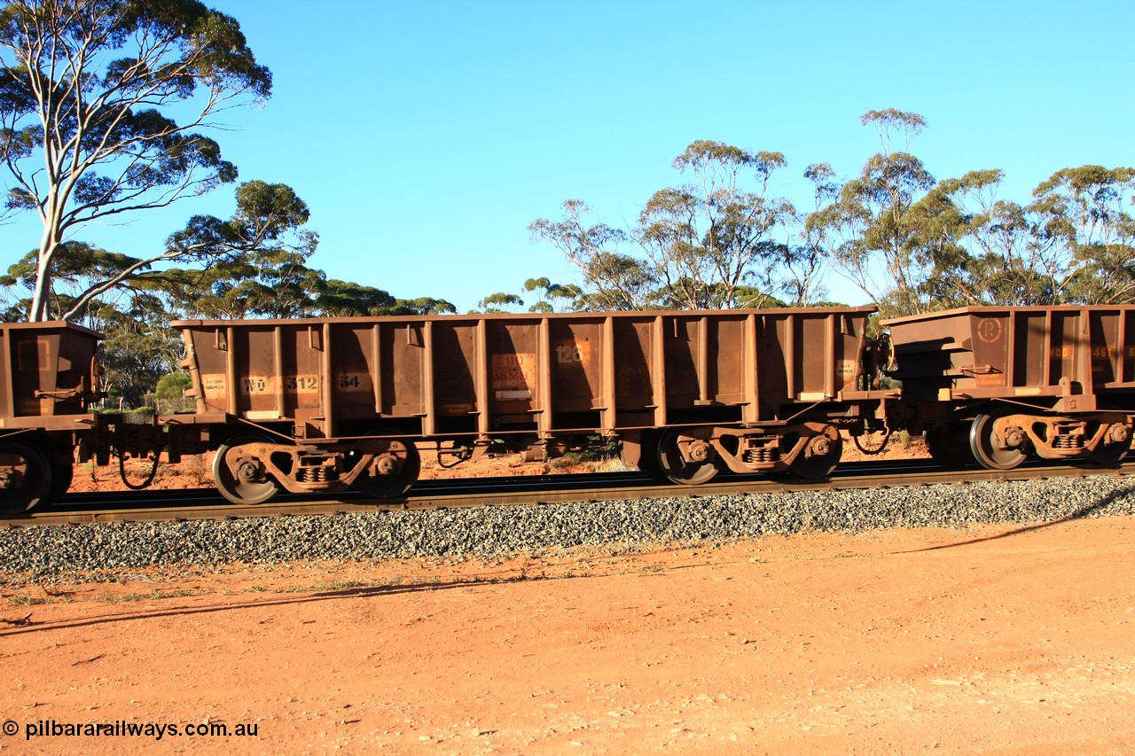 100731 03075
WO type iron ore waggon WO 31234 is one of a batch of eighty six built by WAGR Midland Workshops between 1967 and March 1968 with fleet number 126 for Koolyanobbing iron ore operations, with a 75 ton and 1018 ft³ capacity, empty train arriving at Binduli Triangle, 31st July 2010. This unit was converted to WOS superphosphate in the late 1980s till 1994 when it was re-classed back to WO.
Keywords: WO-type;WO31234;WAGR-Midland-WS;WOS-type;