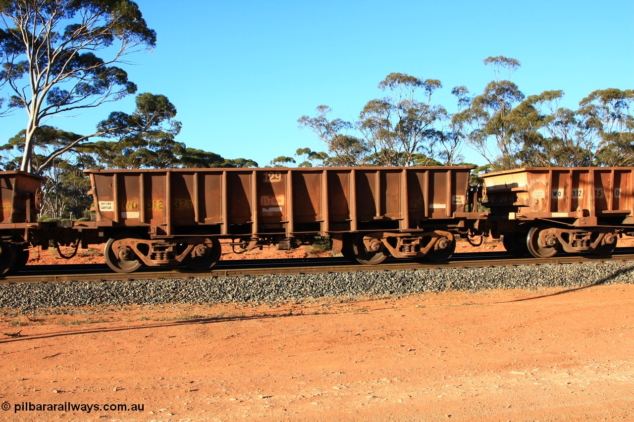 100731 03080
WO type iron ore waggon WO 31237 is one of a batch of eighty six built by WAGR Midland Workshops between 1967 and March 1968 with fleet number 129 for Koolyanobbing iron ore operations, with a 75 ton and 1018 ft³ capacity, empty train arriving at Binduli Triangle, 31st July 2010. This unit was converted to WOC for coal in 1986 till 1994 when it was re-classed back to WO.
Keywords: WO-type;WO31237;WAGR-Midland-WS;