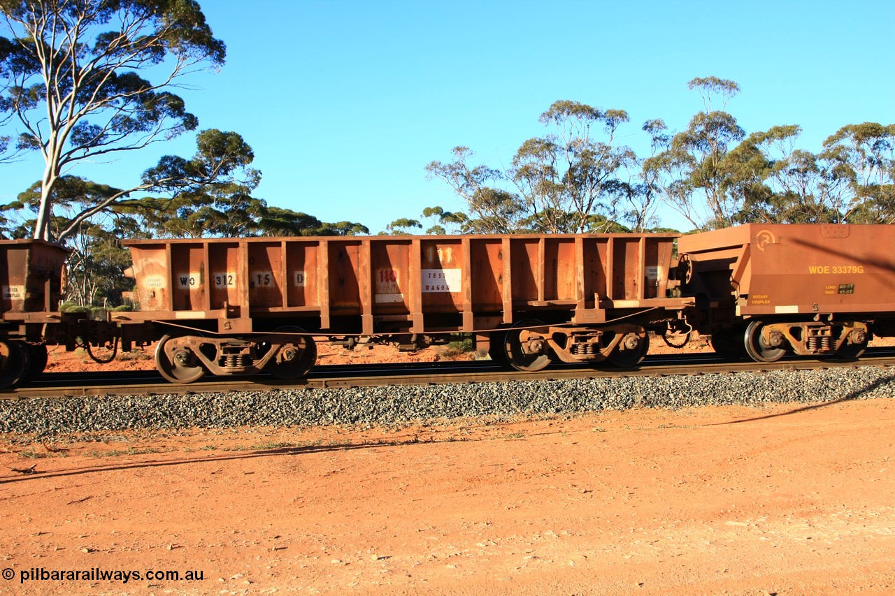 100731 03081
WO type iron ore waggon WO 31215 is one of a batch of sixty two built by Goninan WA between April and August 2000 with serial number 950086-003 and fleet number 111 for Koolyanobbing iron ore operations, marked as a TEST WAGGON, and is a Goninan built replacement WO type waggon with a build date of 04/2000, this replaces the original WAGR built WO type waggon with a WOD type with square features opposed to the curved ones as on the original WO, empty train arriving at Binduli Triangle, 31st July 2010.
Keywords: WO-type;WO31215;Goninan-WA;950086-003;