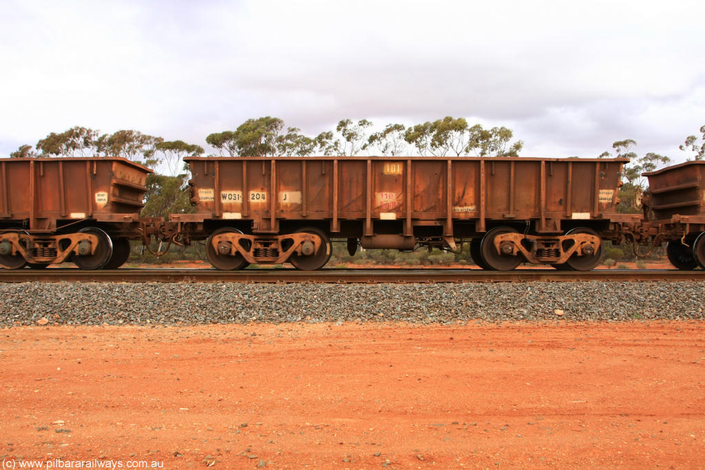 100822 5934
WO type iron ore waggon WO 31204 is one of a batch of eighty six built by WAGR Midland Workshops between 1967 and March 1968 with fleet number 101 for Koolyanobbing iron ore operations with a 75 ton and 1018 ft.³ capacity, Binduli Triangle 22nd August 2010. This unit was converted to WOS superphosphate in the late 1980s till 1994 when it was re-classed back to WO.
Keywords: WO-type;WO31204;WAGR-Midland-WS;WOS-type