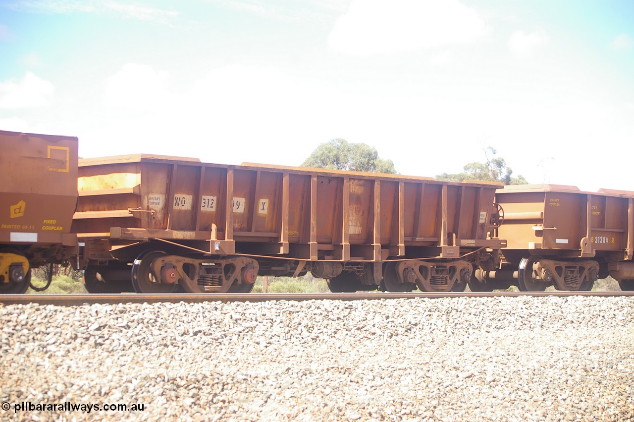 PD 12607
Binduli, WO type iron ore waggon WO 31209 is leader of a batch of sixty two built by Goninan WA between April and August 2000 with serial number 950086-001 and fleet number 105 for Koolyanobbing iron ore operations, and is a Goninan built replacement WO type waggon with a build date of 05/2000, this replaces the original WAGR built WO type waggon with a WOD type with square features opposed to the curved ones as on the original WO. Also note the angled lip extension to the top of the body.
Keywords: Peter-D-Image;WO-type;WO31209;Goninan-WA;950086-001;