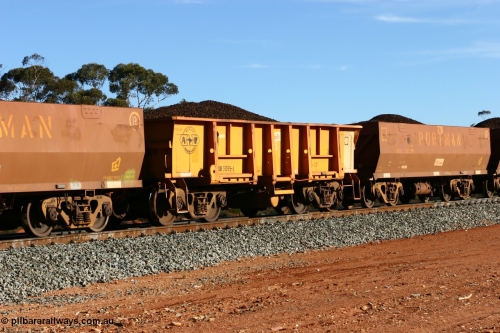 060530 4969
WOB type iron ore waggon WOB 31395 is one of a batch of twenty five built by Comeng WA between 1974 and 1975 and converted from Mt Newman high sided waggons by WAGR Midland Workshops with a capacity of 67 tons with fleet number 325 for Koolyanobbing iron ore operations. This waggon was also converted to a WSM type ballast hopper by re-fitting the cut down top section and having bottom discharge doors fitted, converted back to WOB in 1997. This is the first one to be repainted in ARG yellow, shows capacity of 32M³, loaded with lump ore at Binduli, 30th May 2006.
Keywords: WOB-type;WOB31395;Comeng-WA;WSM-type;Mt-Newman-Mining;