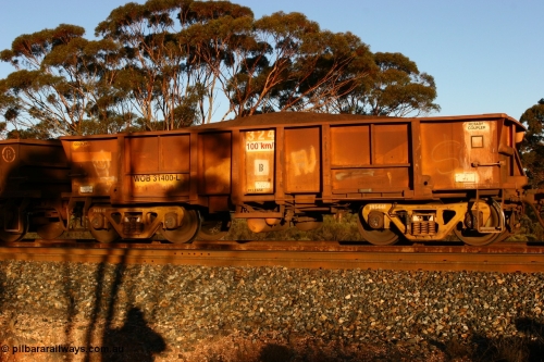 070530 9591
WOB type iron ore waggon WOB 31400 is one of a batch of twenty five built by Comeng WA between 1974 and 1975 and converted from Mt Newman high sided waggons by WAGR Midland Workshops with a capacity of 67 tons with fleet number 324 for Koolyanobbing iron ore operations, but purchased by WAGR. This waggon is one of the 15 converted to WSM type ballast hoppers by re-fitting the removed top section of the body and fitting bottom discharge doors, converted back to WOB in 1998. The angled lines from this conversion are still visible. Loaded train at Binduli, 30th May 2007.
Keywords: WOB-type;WOB31400;Comeng-WA;WSM-type;Mt-Newman-Mining;