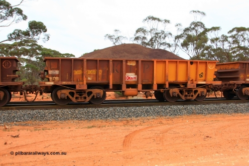 100605 9334
WOC type iron ore waggon WOC 31360 is one of a batch of thirty built by Goninan WA between October 1997 to January 1998 with fleet number 420 for Koolyanobbing iron ore operations with a 75 ton capacity and lettered for KIPL, Koolyanobbing Iron Pty Ltd, with the non-handbrake end repainted, seen here loaded with fines ore, Binduli, June 5, 2010.
Keywords: WOC-type;WOC31360;Goninan-WA;