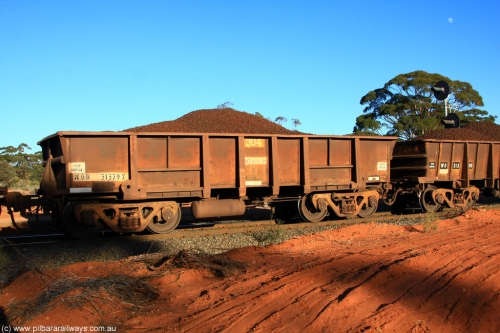 100731 02346
WOB type iron ore waggon WOB 31379 is one of a batch of twenty five built by Comeng WA between 1974 and 1975 and converted from Mt Newman high sided waggons by WAGR Midland Workshops with a capacity of 67 tons with fleet number 304 for Koolyanobbing iron ore operations, the WAGR and Comeng builders plates are visible in the waggon sill, on loaded train 6413 at Binduli Triangle, July 31, 2010.
Keywords: WOB-type;WOB31379;Comeng-WA;Mt-Newman-Mining;
