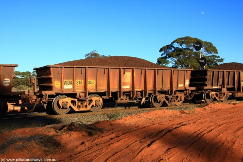 100731 02360
WOA type iron ore waggon WOA 31335 is one of a batch of thirty nine built by WAGR Midland Workshops between 1970 and 1971 with fleet number 215 for Koolyanobbing iron ore operations, with a 75 ton and 1018 ft³ capacity, on loaded train 6413 at Binduli Triangle, July 31, 2010.
Keywords: WOA-type;WOA31335;WAGR-Midland-WS;