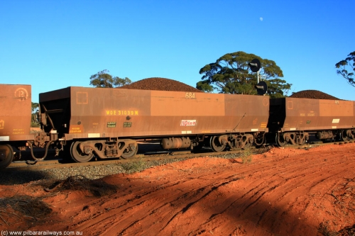 100731 02392
WOE type iron ore waggon WOE 31099 is one of a batch of one hundred and thirty built by Goninan WA between March and August 2001 with serial number 950092-089 and fleet number 684 for Koolyanobbing iron ore operations, on loaded train 6413 at Binduli Triangle, July 31, 2010.
Keywords: WOE-type;WOE31099;Goninan-WA;950092-089;