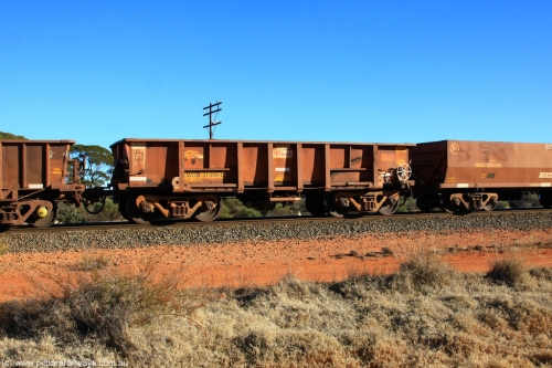 100731 02422
WOB type iron ore waggon WOB 31396 is one of a batch of twenty five built by Comeng WA between 1974 and 1975 and converted from Mt Newman high sided waggons by WAGR Midland Workshops with a capacity of 67 tons with fleet number 320 for Koolyanobbing iron ore operations. This waggon was also converted to a WSM type ballast hopper by re-fitting the cut down top section and having bottom discharge doors fitted, converted back to WOB in 1998, on empty train 6418 at Binduli Triangle, July 31, 2010.
Keywords: WOB-type;WOB31396;Comeng-WA;WSM-type;Mt-Newman-Mining;