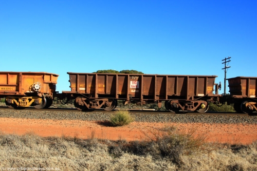 100731 02425
WO type iron ore waggon WO 31301 is one of a batch of fifteen built by WAGR Midland Workshops between July and October 1968 with fleet number 179 for Koolyanobbing iron ore operations, with a 75 ton and 1018 ft³ capacity, on empty train 6418 at Binduli Triangle, July 31, 2010. This unit was converted to WOC for coal in 1986 till 1994 when it was re-classed back to WO.
Keywords: WO-type;WO31301;WAGR-Midland-WS;