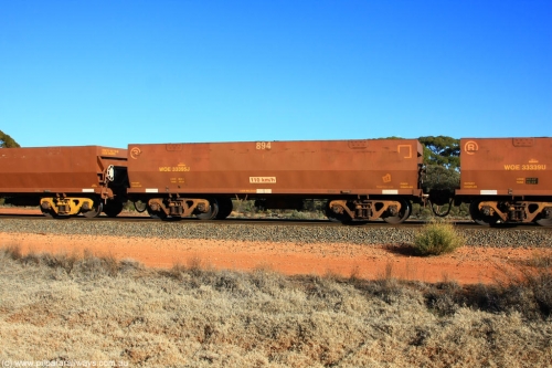 100731 02430
WOE type iron ore waggon WOE 33395 is one of a batch of one hundred and forty one built by United Group Rail WA between November 2005 and April 2006 with serial number 950142-100 and fleet number 894 for Koolyanobbing iron ore operations, on empty train 6418 at Binduli Triangle, July 31, 2010.
Keywords: WOE-type;WOE33395;United-Group-Rail-WA;950142-100;