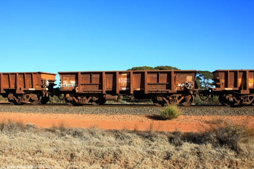 100731 02435
WOB type iron ore waggon WOB 31383 is one of a batch of twenty five built by Comeng WA between 1974 and 1975 and converted from Mt Newman high sided waggons by WAGR Midland Workshops with a capacity of 67 tons with fleet number 308 for Koolyanobbing iron ore operations, on empty train 6418 at Binduli Triangle, July 31, 2010.
Keywords: WOB-type;WOB31383;Comeng-WA;Mt-Newman-Mining;