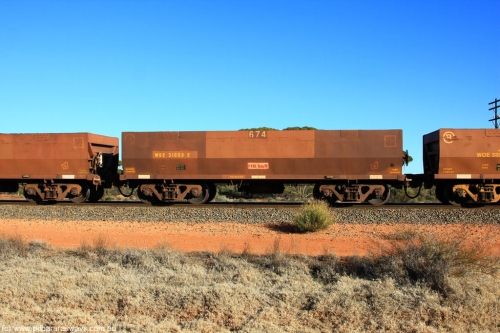 100731 02461
WOE type iron ore waggon WOE 31089 is one of a batch of one hundred and thirty built by Goninan WA between March and August 2001 with serial number 950092-079 and fleet number 674 for Koolyanobbing iron ore operations, on empty train 6418 at Binduli Triangle, 31st July 2010.
Keywords: WOE-type;WOE31089;Goninan-WA;950092-079;