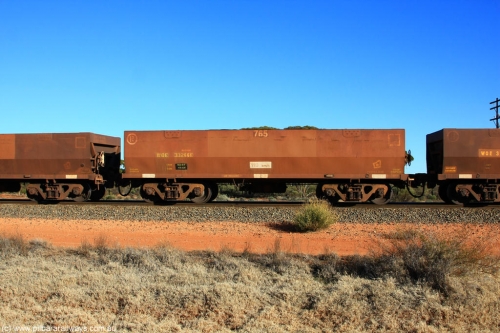 100731 02462
WOE type iron ore waggon WOE 33266 is one of a batch of thirty five built by Goninan WA between January and April 2005 with serial number 950104-006 and fleet number 765 for Koolyanobbing iron ore operations, on empty train 6418 at Binduli Triangle, July 31, 2010.
Keywords: WOE-type;WOE33266;Goninan-WA;950104-006;