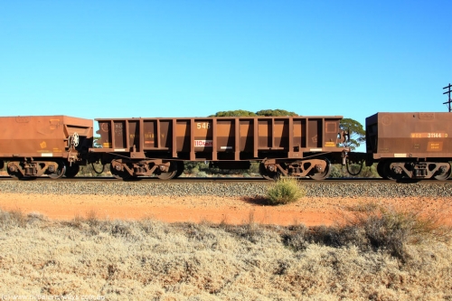 100731 02480
WOD type iron ore waggon WOD 31483 is one of a batch of sixty two built by Goninan WA between April and August 2000 with serial number 950086-055 and fleet number 546 for Koolyanobbing iron ore operations with a 75 ton capacity for Portman Mining to cart their Koolyanobbing iron ore to Esperance, now with PORTMAN painted out, on empty train 6418 at Binduli Triangle, July 31, 2010.
Keywords: WOD-type;WOD31483;Goninan-WA;950086-055;