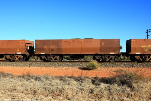 100731 02482
WOE type iron ore waggon WOE 31137 is one of a batch of one hundred and thirty built by Goninan WA between March and August 2001 with serial number 950092-127 and fleet number 719 for Koolyanobbing iron ore operations, on empty train 6418 at Binduli Triangle, July 31, 2010.
Keywords: WOE-type;WOE31137;Goninan-WA;950092-127;