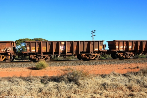 100731 02532
WO type iron ore waggon WO 31213 is one of a batch of eighty six built by WAGR Midland Workshops between 1967 and March 1968 with fleet number 109 for Koolyanobbing iron ore operations, with a 75 ton and 1018 ft³ capacity, on empty train 6418 at Binduli Triangle, July 31, 2010. This unit was converted to WOG for gypsum in late 1980s till 1990 then reclassed to WOS for superphosphate before being re-classed back to WO in 1994.
Keywords: WO-type;WO31213;WAGR-Midland-WS;