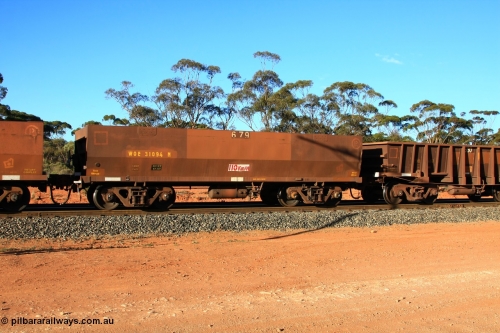 100731 03167
WOE type iron ore waggon WOE 31094 is one of a batch of one hundred and thirty built by Goninan WA between March and August 2001 with serial number 950092-084 and fleet number 679 for Koolyanobbing iron ore operations of 83 tonne load capacity built for Portman Mining with PORTMAN painted out and the load revised down to 82.5 tonnes, empty train arriving at Binduli Triangle, July 31, 2010.
Keywords: WOE-type;WOE31094;Goninan-WA;950092-084;