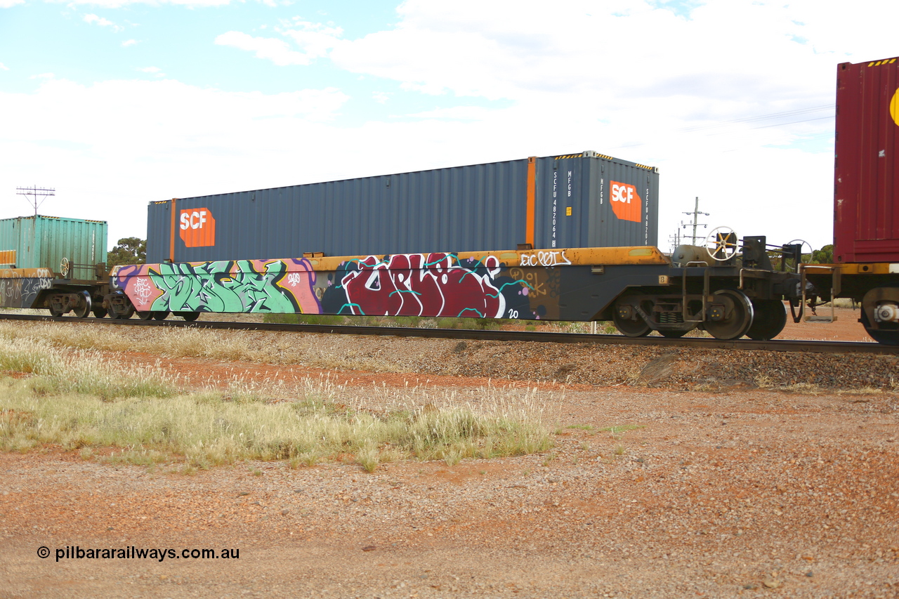 210407 9886
Parkeston, 2MP5 intermodal train, RRZY 7049 platform 5 of 5-pack well waggon set. Originally was an RQZY type, a five unit bar coupled well container waggon built as one of a batch of thirty two by Goninan NSW for National Rail in 1995/96. Recoded to RRZY when repaired. Loaded with an SCF 48' MFGB type container SCFU 482064.
Keywords: RRZY-type;RRZY7049;Goninan-NSW;RQZY-type;