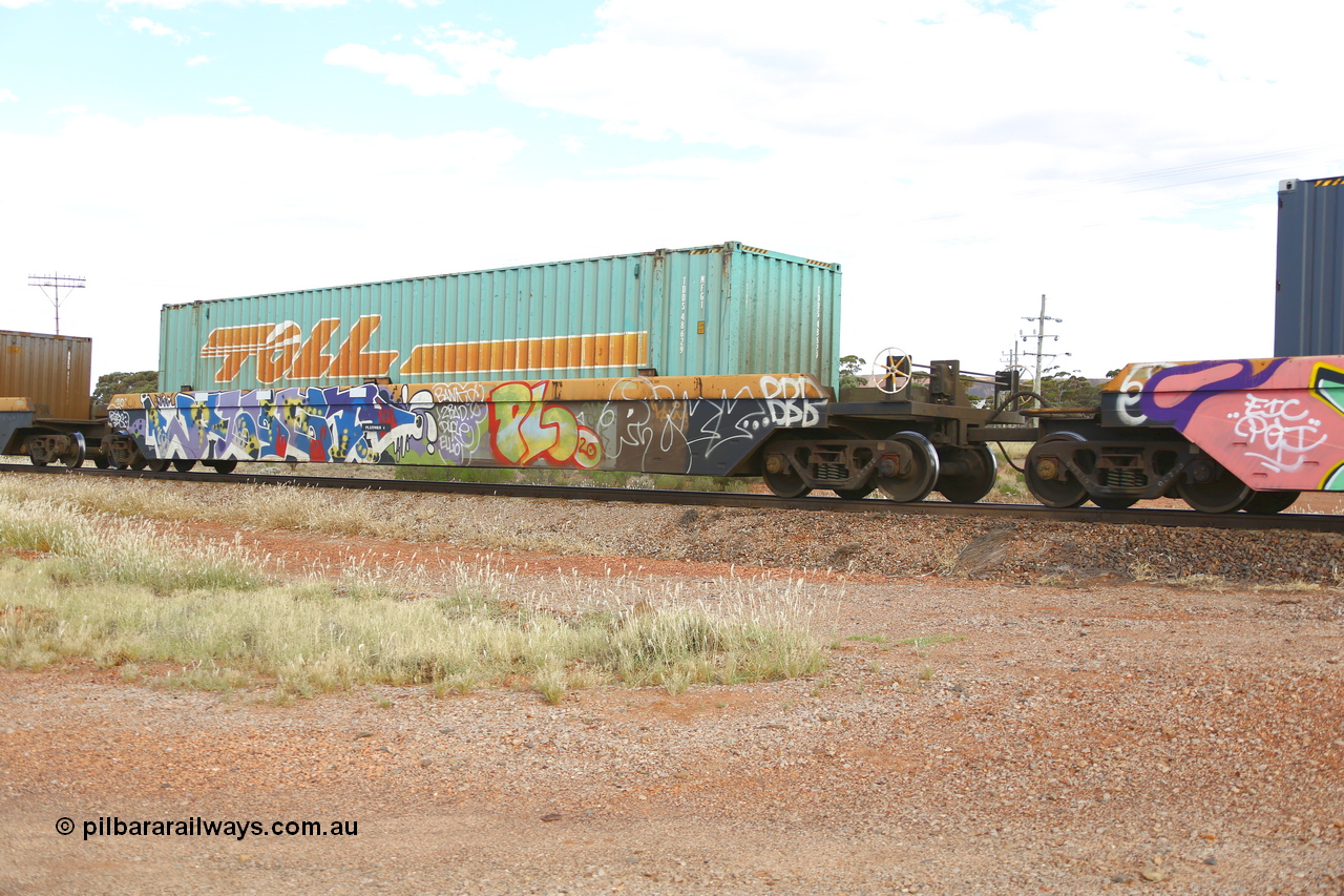 210407 9887
Parkeston, 2MP5 intermodal train, RRZY 7049 platform 4 of 5-pack well waggon set. Originally was an RQZY type, a five unit bar coupled well container waggon built as one of a batch of thirty two by Goninan NSW for National Rail in 1995/96. Recoded to RRZY when repaired. Loaded with a Toll 48' MFG1 type container TCML 48629.
Keywords: RRZY-type;RRZY7049;Goninan-NSW;RQZY-type;