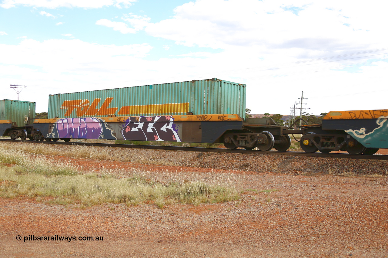 210407 9889
Parkeston, 2MP5 intermodal train, RRZY 7049 platform 2 of 5-pack well waggon set. Originally was an RQZY type, a five unit bar coupled well container waggon built as one of a batch of thirty two by Goninan NSW for National Rail in 1995/96. Recoded to RRZY when repaired. Loaded with a Toll 48' MEG1 type container TCML 48525.
Keywords: RRZY-type;RRZY7049;Goninan-NSW;RQZY-type;