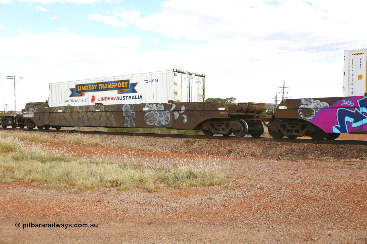 210407 9894
Parkeston, 2MP5 intermodal train, CQWY type well waggon CQWY 5060 well 2, the final set of well waggon pairs were built by Bluebird Rail Operations SA in a batch of sixty pairs in 2008 for CFCLA. Loaded with a 40' Lindsay Transport reefer LTCD 401806.
Keywords: CQWY-type;CQWY5060;CFCLA;Bluebird-Rail-Operations-SA;