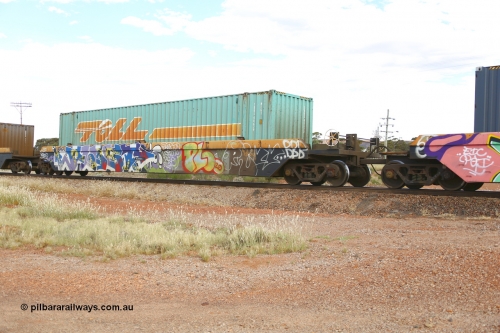 210407 9887
Parkeston, 2MP5 intermodal train, RRZY 7049 platform 4 of 5-pack well waggon set. Originally was an RQZY type, a five unit bar coupled well container waggon built as one of a batch of thirty two by Goninan NSW for National Rail in 1995/96. Recoded to RRZY when repaired. Loaded with a Toll 48' MFG1 type container TCML 48629.
Keywords: RRZY-type;RRZY7049;Goninan-NSW;RQZY-type;