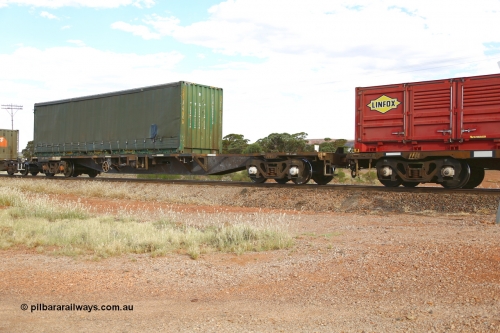 210407 9900
Parkeston, 2MP5 intermodal train, RQFY type flat waggon RQFY 119 is a VQFX type skeletal container waggon built by Victorian Railways Bendigo Workshops in 1980 in a batch of seventy five. Recoded to VQFY in 1985, then to RQFY in 1994, then National Rail RQFF in 1995. Loaded with a 40' curtain sider container FICU 000002.
Keywords: RQFY-type;RQFY119;Victorian-Railways-Bendigo-WS;VQFX-type;VQFY-type;RQFF-type;