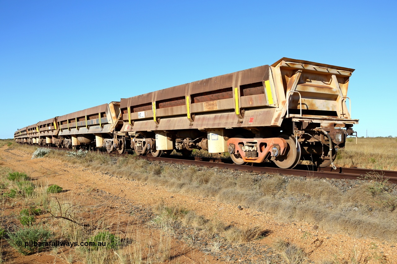 180527 1200
Pippingarra, near the 17 km on the former Goldsworthy line, BHP has stored some redundant service waggons, Difco side dumps, a couple of heavy weights and the old winch and crib waggons from the steel train. Looking east with a former GML short Difco side dump waggon on the end. 27th May 2018. [url=https://goo.gl/maps/duWQ1f8kqf92]GeoData[/url].
