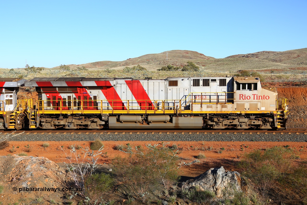 180616 1659
Cooya Pooya, 32 km on the Cape Lambert line, Rio Tinto loco 9103 with serial 61941 a GE Erie built GE model ES44ACi from the 1st order in Rio Tinto Stripes livery side view, following a total loss of air, the locomotive's hose bag is chained to the rail in case of movement. The train pulled a coupling around the 45 car position. 16th June 2018. [url=https://goo.gl/maps/ckyFypg4LAy]Geodata[/url]
Keywords: 9103;61941;GE;ES44ACi;Rio-Tinto-Stripes;